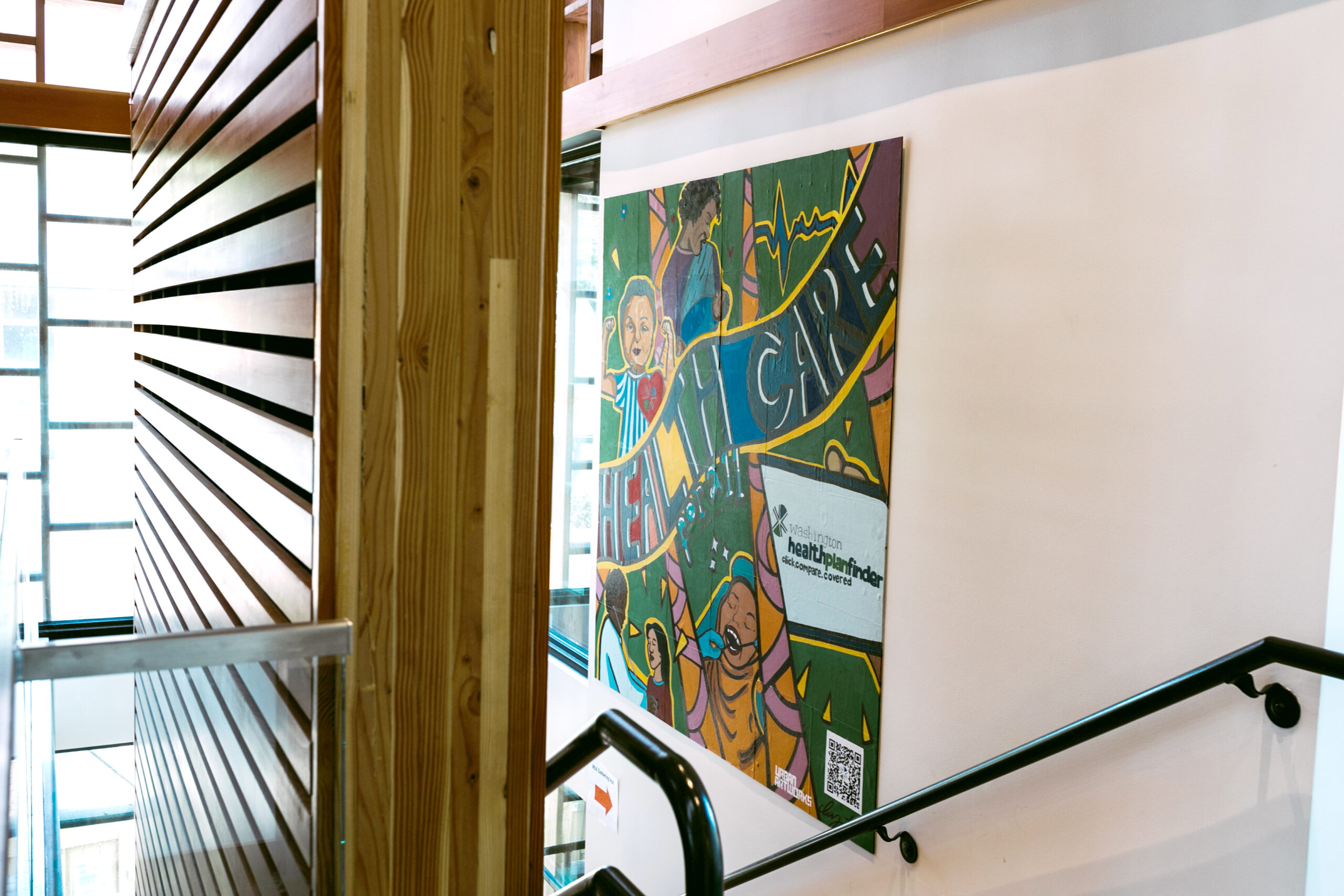 This image shows the final mural hanging in the hallway at the Refugee Women’s Alliance (ReWA) offices.