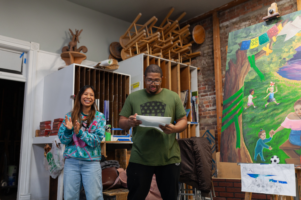 Teaching Artists Carmel Mercado and Charles Conner leading youth throughout at The Kirkland MAP cohort. The cohort created a mural at the Kirkland Arts Center with The mural was created for the Center for Human Services for their Substance Use Department and Family Support Department.