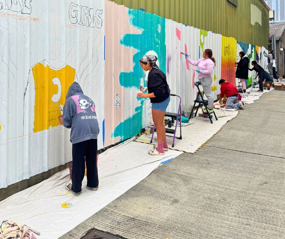 Youth Artists and Teaching Artists painting their murals together.