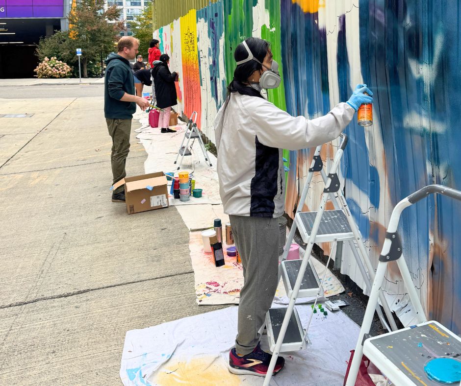 Youth Artists and Teaching Artists painting their murals together.