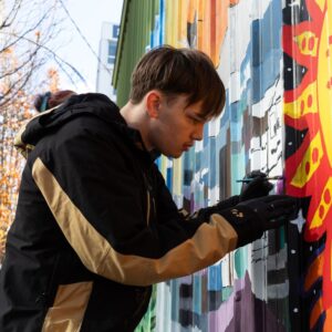 Youth Artists Jake Hudson painting his mural.