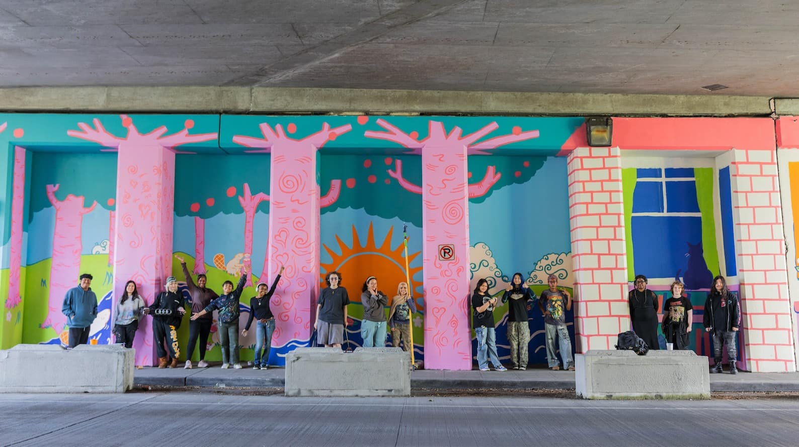 Base Crew youth artists and Teaching Artists with their mural